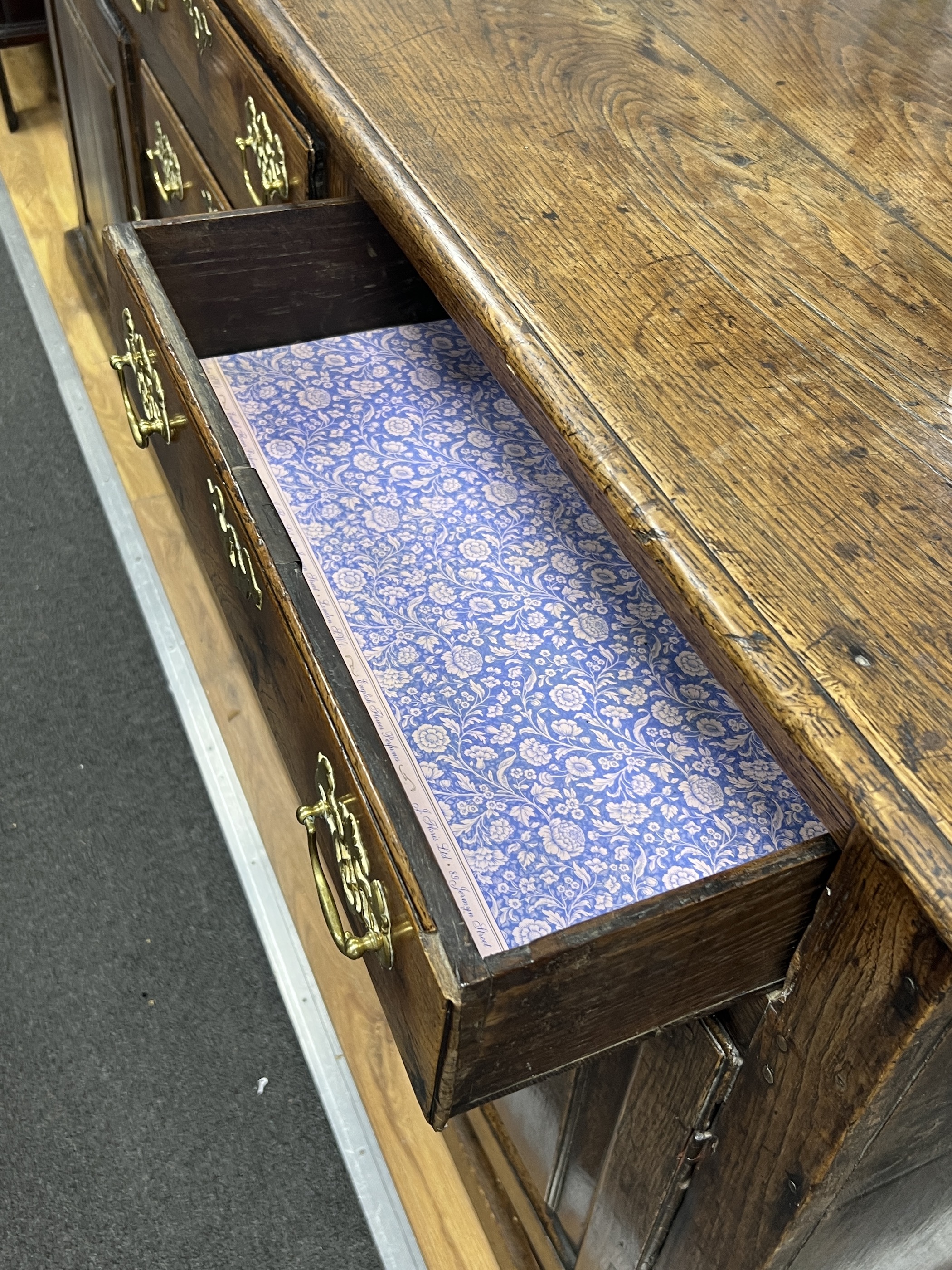 An 18th century oak low dresser, width 192cm, depth 51cm, height 89cm